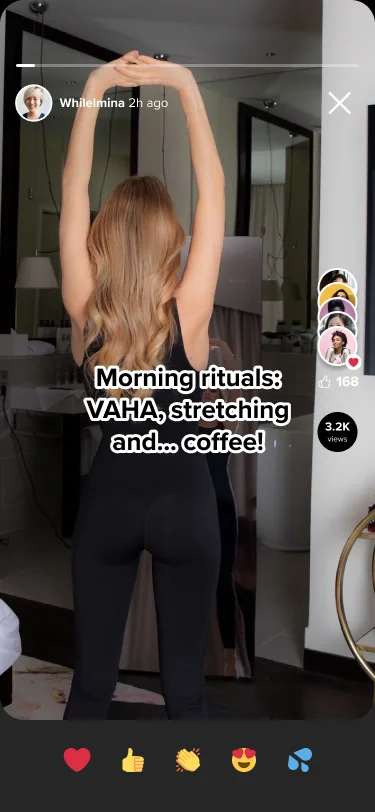 A friend's photo story: a member stretching in front of a mirror, with a caption about her morning routine, viewer avatars, a like count and a view count down the side, and five reaction buttons below.
