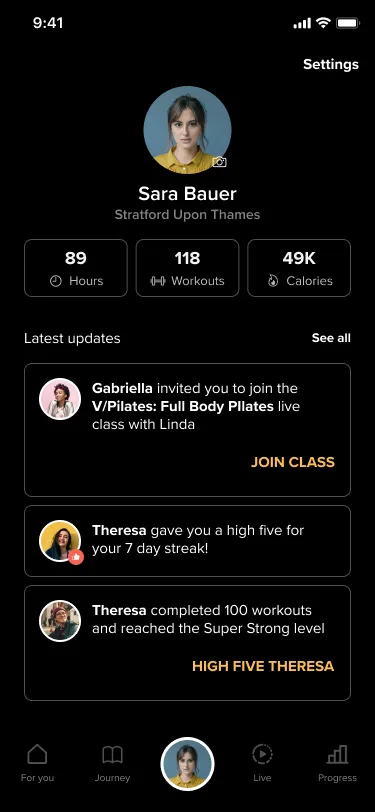 Test B profile screen with a Settings link and no back arrow, the member's photo, name and location, three stat tiles, the three latest updates with their actions, and the tab bar with the member's photo selected.